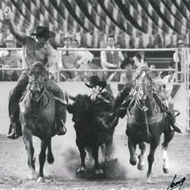 Lee in the finals at Rodeo Houston with Bill Duvall hazing